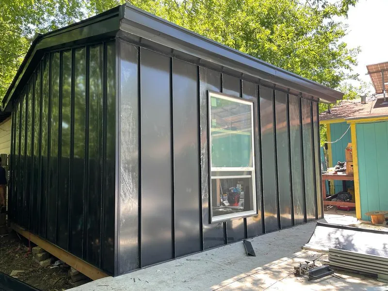 Black standing seam metal wall panels for Roof Inspection in New Hyde Park